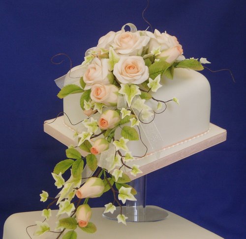 Trailing Peach Roses Wedding Cake