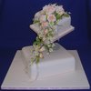 Trailing Peach Roses Wedding Cake